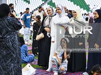 People are gathering after Eid al-Adha morning prayer at the Education City Stadium on the first day of the Eid al-Adha holiday in Doha, Qat...