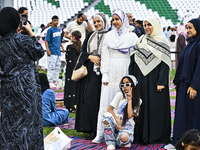 People are gathering after Eid al-Adha morning prayer at the Education City Stadium on the first day of the Eid al-Adha holiday in Doha, Qat...