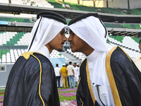 People are greeting each other after performing the Eid al-Adha morning prayer at the Education City Stadium on the first day of the Eid al-...