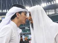 People are greeting each other after performing the Eid al-Adha morning prayer at the Education City Stadium on the first day of the Eid al-...