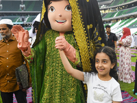 Children are celebrating after performing the Eid al-Adha morning prayer at the Education City Stadium on the first day of the Eid al-Adha h...