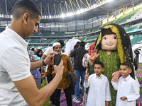 Children are celebrating after performing the Eid al-Adha morning prayer at the Education City Stadium on the first day of the Eid al-Adha h...