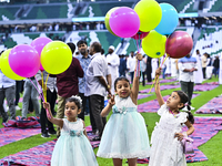 Children are celebrating after performing the Eid al-Adha morning prayer at the Education City Stadium on the first day of the Eid al-Adha h...