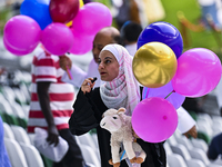 People are celebrating after performing the Eid al-Adha morning prayer at the Education City Stadium on the first day of the Eid al-Adha hol...