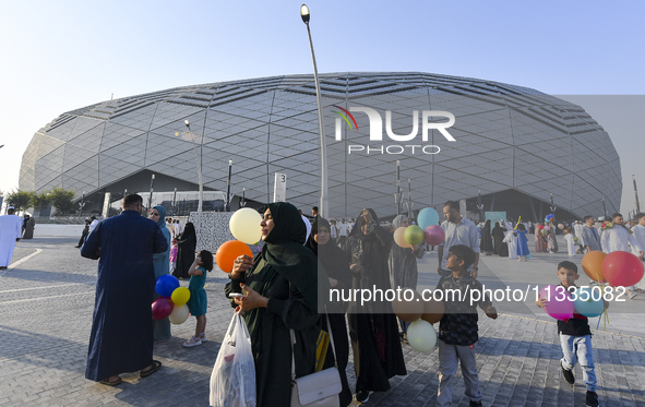 Worshipers are leaving the stadium after performing the Eid al-Adha morning prayer on the first day of the Eid al-Adha holiday in Doha, Qata...