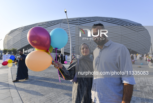 Worshipers are leaving the stadium after performing the Eid al-Adha morning prayer on the first day of the Eid al-Adha holiday in Doha, Qata...