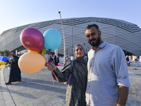 Worshipers are leaving the stadium after performing the Eid al-Adha morning prayer on the first day of the Eid al-Adha holiday in Doha, Qata...