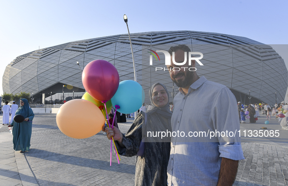 Worshipers are leaving the stadium after performing the Eid al-Adha morning prayer on the first day of the Eid al-Adha holiday in Doha, Qata...