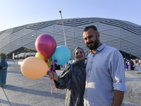 Worshipers are leaving the stadium after performing the Eid al-Adha morning prayer on the first day of the Eid al-Adha holiday in Doha, Qata...