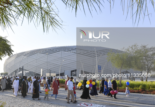 Worshipers are leaving the stadium after performing the Eid al-Adha morning prayer on the first day of the Eid al-Adha holiday in Doha, Qata...