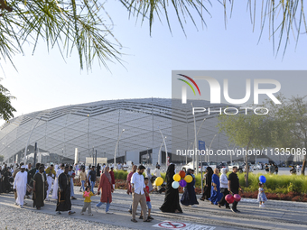 Worshipers are leaving the stadium after performing the Eid al-Adha morning prayer on the first day of the Eid al-Adha holiday in Doha, Qata...