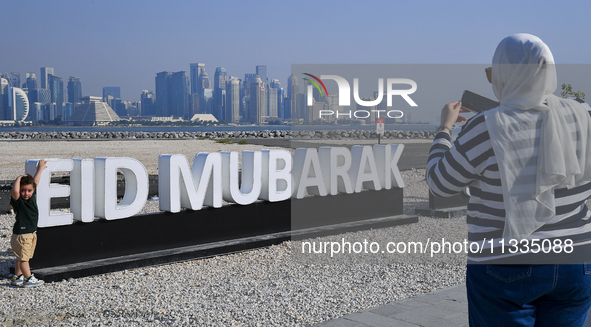 Eid Mubarak decorations are being displayed at Old Doha Port as part of the Eid celebrations in Doha, Qatar, on June 16, 2024. Muslims aroun...