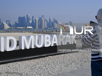 Eid Mubarak decorations are being displayed at Old Doha Port as part of the Eid celebrations in Doha, Qatar, on June 16, 2024. Muslims aroun...