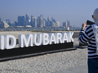 Eid Mubarak decorations are being displayed at Old Doha Port as part of the Eid celebrations in Doha, Qatar, on June 16, 2024. Muslims aroun...