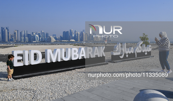 Eid Mubarak decorations are being displayed at Old Doha Port as part of the Eid celebrations in Doha, Qatar, on June 16, 2024. Muslims aroun...