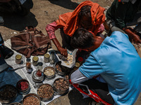 Non-locals are selling herbal medicines, which they claim have been collected from forests in Sopore, Jammu and Kashmir, India, on June 16,...