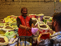 A vendor is selling spices to customers ahead of Eid-Ul-Acha in Sopore, Jammu and Kashmir, India, on June 16, 2024 (