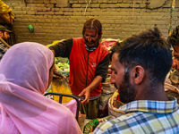 A vendor is selling spices to customers ahead of Eid-Ul-Acha in Sopore, Jammu and Kashmir, India, on June 16, 2024 (