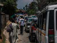 People are walking as they shop for Eid-Ul-Adha in Sopore, Jammu and Kashmir, India, on June 16, 2024. (