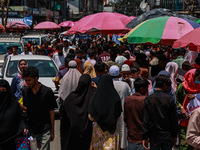 People are walking as they shop for Eid-Ul-Adha in Sopore, Jammu and Kashmir, India, on June 16, 2024. (