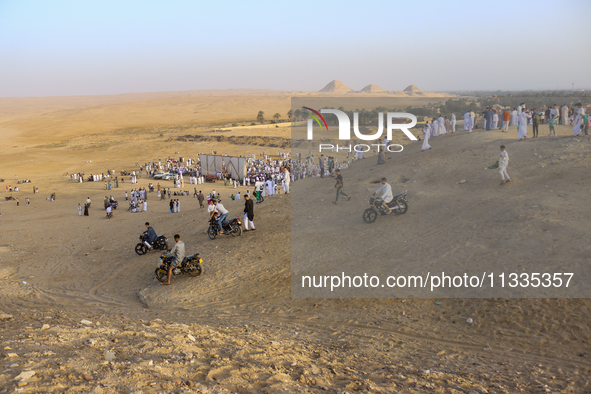 People are performing Eid al-Adha prayers in the village of Abu Sir, Giza, Egypt, on June 16, 2024. 