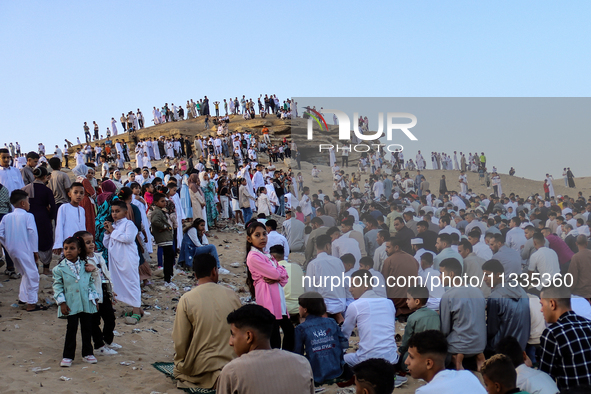 People are performing Eid al-Adha prayers in the village of Abu Sir, Giza, Egypt, on June 16, 2024. 