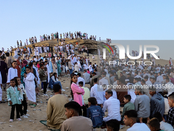 People are performing Eid al-Adha prayers in the village of Abu Sir, Giza, Egypt, on June 16, 2024. (