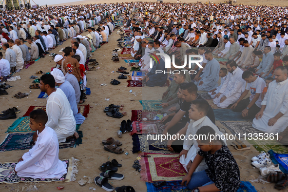 People are performing Eid al-Adha prayers in the village of Abu Sir, Giza, Egypt, on June 16, 2024. 