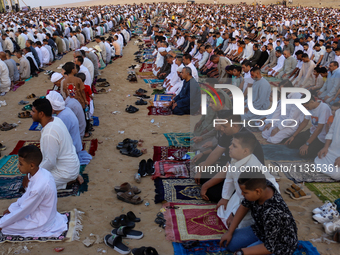 People are performing Eid al-Adha prayers in the village of Abu Sir, Giza, Egypt, on June 16, 2024. (