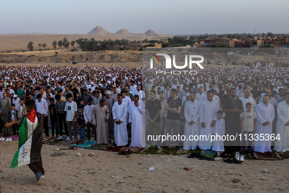 People are performing Eid al-Adha prayers in the village of Abu Sir, Giza, Egypt, on June 16, 2024. 