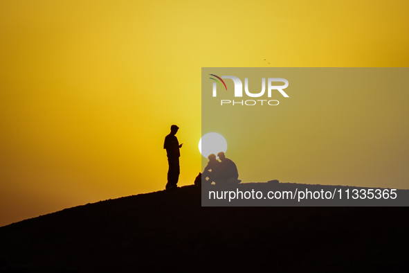 People are performing Eid al-Adha prayers in the village of Abu Sir, Giza, Egypt, on June 16, 2024. 