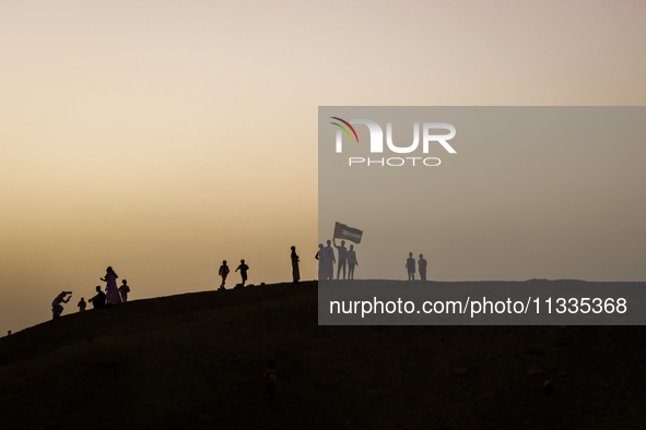 People are performing Eid al-Adha prayers in the village of Abu Sir, Giza, Egypt, on June 16, 2024. 