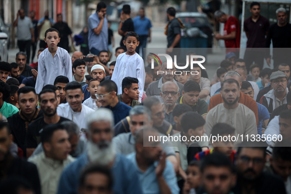 Palestinians are holding Eid al-Adha prayers in Bureij Refugee Camp in the central Gaza Strip, on June 16, 2024, amid the ongoing conflict b...