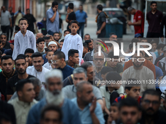 Palestinians are holding Eid al-Adha prayers in Bureij Refugee Camp in the central Gaza Strip, on June 16, 2024, amid the ongoing conflict b...