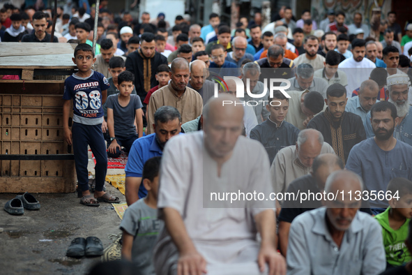 Palestinians are holding Eid al-Adha prayers in Bureij Refugee Camp in the central Gaza Strip, on June 16, 2024, amid the ongoing conflict b...