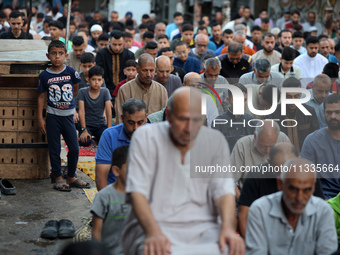 Palestinians are holding Eid al-Adha prayers in Bureij Refugee Camp in the central Gaza Strip, on June 16, 2024, amid the ongoing conflict b...