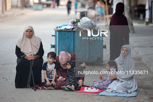 Palestinians are holding Eid al-Adha prayers in Bureij Refugee Camp in the central Gaza Strip, on June 16, 2024, amid the ongoing conflict b...