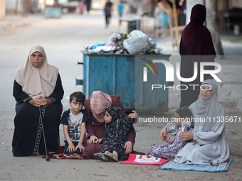 Palestinians are holding Eid al-Adha prayers in Bureij Refugee Camp in the central Gaza Strip, on June 16, 2024, amid the ongoing conflict b...