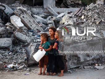 Palestinian girls are attending Eid al-Adha prayers in Bureij Refugee Camp in the central Gaza Strip, on June 16, 2024, amid the ongoing con...