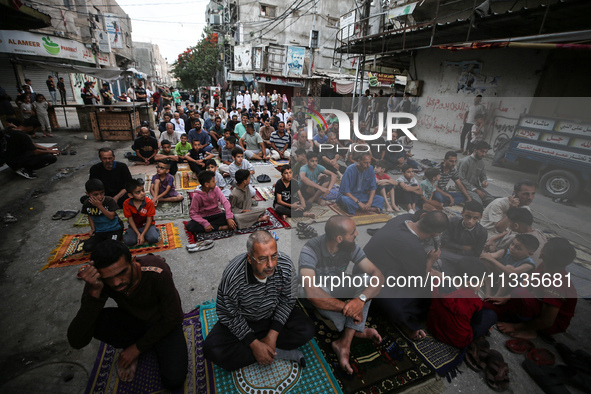 Palestinians are holding Eid al-Adha prayers in Bureij Refugee Camp in the central Gaza Strip, on June 16, 2024, amid the ongoing conflict b...