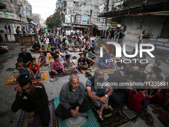 Palestinians are holding Eid al-Adha prayers in Bureij Refugee Camp in the central Gaza Strip, on June 16, 2024, amid the ongoing conflict b...