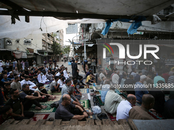 Palestinians are holding Eid al-Adha prayers in Bureij Refugee Camp in the central Gaza Strip, on June 16, 2024, amid the ongoing conflict b...