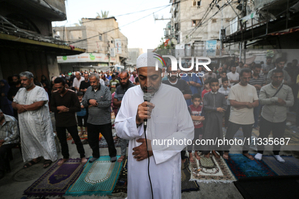 Palestinians are holding Eid al-Adha prayers in Bureij Refugee Camp in the central Gaza Strip, on June 16, 2024, amid the ongoing conflict b...