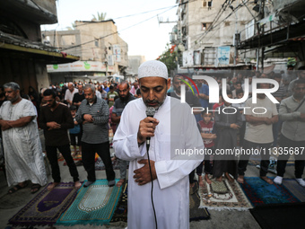 Palestinians are holding Eid al-Adha prayers in Bureij Refugee Camp in the central Gaza Strip, on June 16, 2024, amid the ongoing conflict b...