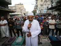 Palestinians are holding Eid al-Adha prayers in Bureij Refugee Camp in the central Gaza Strip, on June 16, 2024, amid the ongoing conflict b...