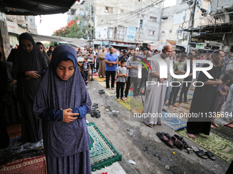 Palestinians are holding Eid al-Adha prayers in Bureij Refugee Camp in the central Gaza Strip, on June 16, 2024, amid the ongoing conflict b...