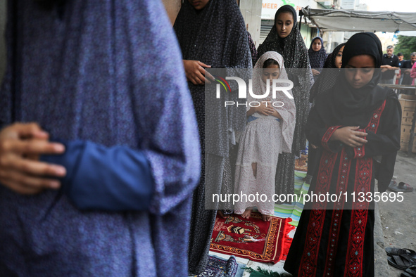 Palestinians are holding Eid al-Adha prayers in Bureij Refugee Camp in the central Gaza Strip, on June 16, 2024, amid the ongoing conflict b...