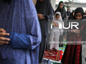 Palestinians are holding Eid al-Adha prayers in Bureij Refugee Camp in the central Gaza Strip, on June 16, 2024, amid the ongoing conflict b...