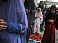 Palestinians are holding Eid al-Adha prayers in Bureij Refugee Camp in the central Gaza Strip, on June 16, 2024, amid the ongoing conflict b...