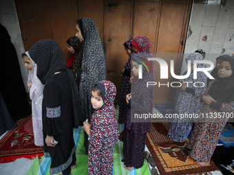 Palestinians are holding Eid al-Adha prayers in Bureij Refugee Camp in the central Gaza Strip, on June 16, 2024, amid the ongoing conflict b...